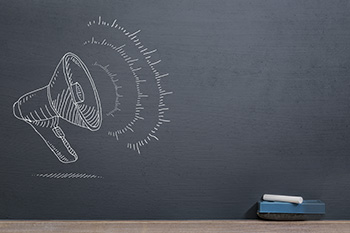 megaphone drawing on a chalkboard