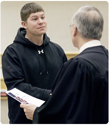 Rock County Circuit Court Judge James P. Daley congratulates Casey