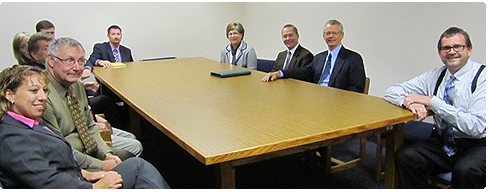 The District Ten tour included a meeting in Rusk County with, from left to right, Court Reporter Shannon Golat, Court Commissioner Terry Nussberger, County Board Chair Randy Tatur, Assistant District Atty. Andrea Amidon-Nodolf, District Atty. Mark Kellaher, Corporation Counsel Richard Sommerfield, Deputy Chief Judge Molly GaleWyrick, Director of State Courts A. John Voelker, Chief Judge Scott R. Needham and Rusk County Circuit Court Judge Steven P. Anderson.