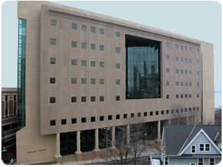 The sandstone color and triangular, flatiron shape of the new Dane County Courthouse help the building to blend with Madison&rsquo;s downtown. The building&rsquo;s angles made construction particularly challenging. 