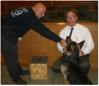 Dane County Deputy Jay O'Neil, Hunter and Dane County Circuit Judge Nicholas J. McNamara, following a demonstration on the use of dogs to search for possible evidence.