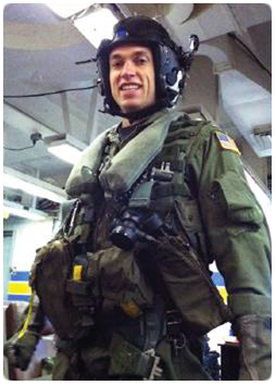 Lt. Carl Davis, wearing his flight gear, was able to show his father, Chief Judge J. Mac Davis, Waukesha County Circuit Court, what life aboard an aircraft carrier is like firsthand.
