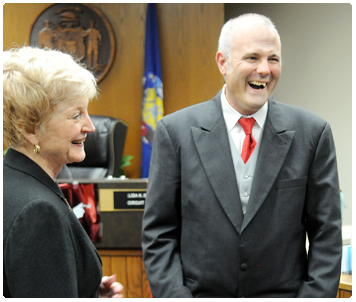 Justice Patience Drake Roggensack shares a lighter moment with Eau Claire County Drug Treatment Court's 50th graduate, Chris Coyer. Photo credit: Dan Reiland/Eau Claire Leader-Telegram