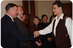 Public Enemies star Johnny Depp shakes hands with Lafayette County Sheriff Scott Pedley, as other county and court staff look on. (Photo by Hillary Dickerson, Republican Journal)