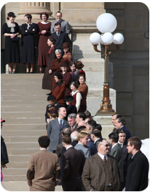 Extras line up outside the historic Darlington courthouse before shooting begins inside. (Photo by Hillary Dickerson, Republican Journal)