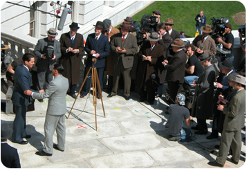 Film stars Christian Bale and Billy Crudup (who plays J. Edgar Hoover) shake hands in a scene shot on the steps of the State Capitol.