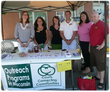 The Sheboygan County Circuit Court public outreach team during a brief break in the action at the popular Saturday farmers market. From left, Judge Angela W. Sutkiewicz, Sheboygan County Circuit Court; Atty. Roberta A. Heckes; Court Commissioner Rebecca L. Persick, Sheboygan County Circuit Court; and Atty. Elizabeth G. Rich.