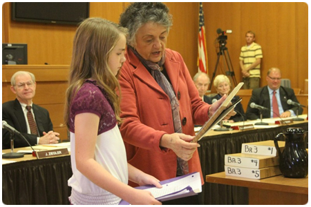 Chief Justice Shirley S. Abrahamson presents Rusch Elementary School fifth-grader Elise Kilde with a plaque for her winning essay about civil rights. The award was presented during the Supreme Court's Justice on Wheels visit to the Columbia County Courthouse in Portage on Oct. 5. Photo credit: Jen McCoy/Portage Daily Register