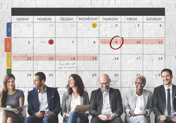 group of people with calendar and dates circled in the background