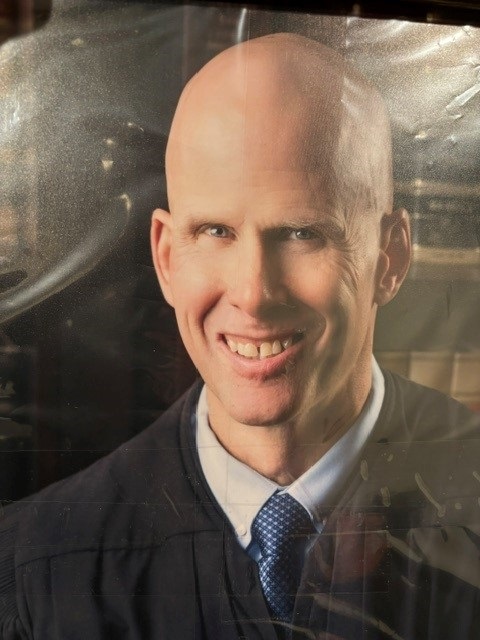 Hon. Guy Dutcher