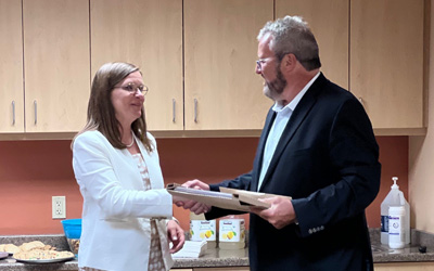 Director of State Courts Randy R. Koschnick presents Diane Fremgen with a plaque of appreciation from the Wisconsin Supreme Court on June 1 in Madison. Fremgen retired as Deputy Director for Court Operations on June 2, after 23 years with the court system. She previously served as Clerk of Supreme Court and Court of Appeals, Winnebago County Clerk of Circuit Court and on the staff of the Winnebago County Clerk of Circuit Court’s office.