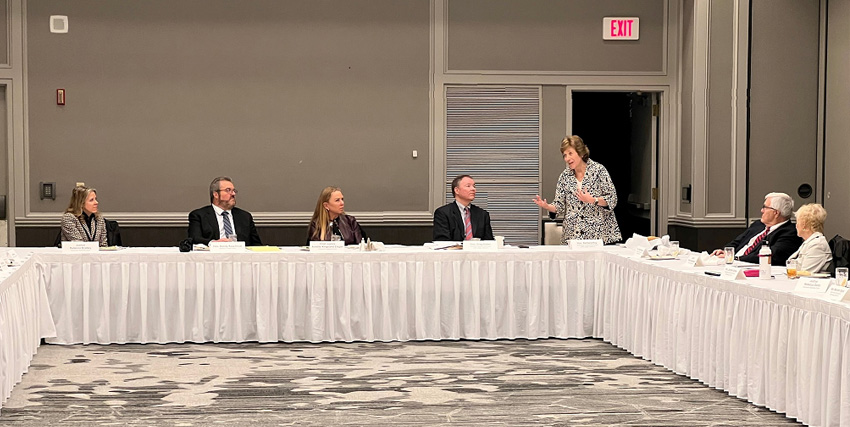 District Four Chief Judge Barbara Hart Key, Winnebago County Circuit Court, standing, addresses a joint meeting of the Wisconsin Supreme Court and Committee of Chief Judges