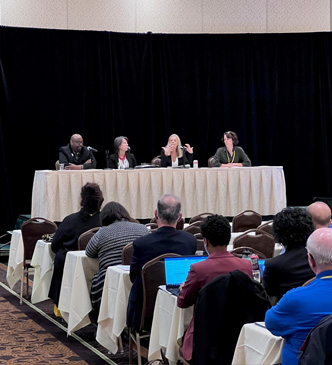 Wisconsin State Public Defender Kelli Thompson, second from right, makes a point during a panel discussion entitled “The 6th Amendment and Access to Justice” at the 2022 Annual Meeting of the Wisconsin Judicial Conference. Others on the panel, from left, include Hon. Derek Mosley, City of Milwaukee Municipal Court, Atty. Collen Foley, executive director, Legal Aid Society of Milwaukee, and Dane County Circuit Court Judge Susan Crawford, moderator.