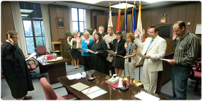 Judge L. Edward Stengel, Sheboygan County Circuit Court, swore in members of the county’s new veterans court program in August 2012. The group included Judge Angela W. Sutkiewicz, who presides in the court. Photo credit: Sheboygan Press